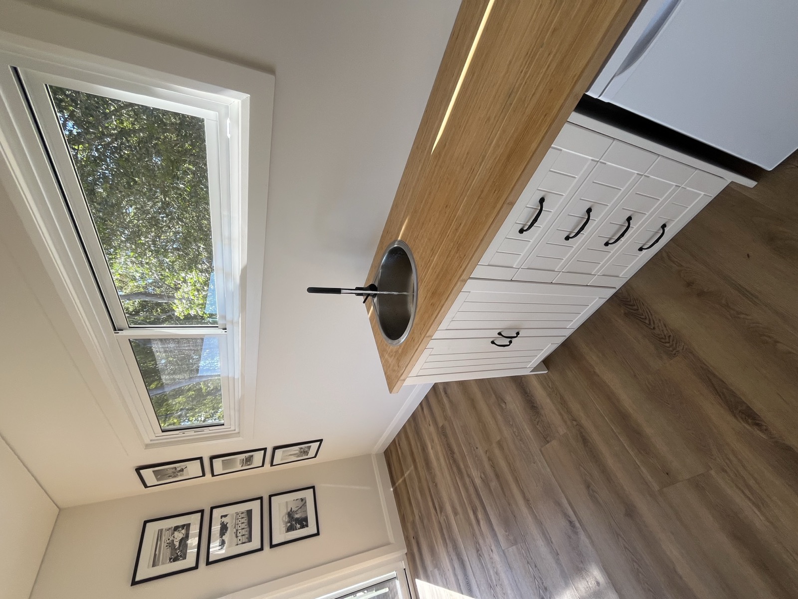 Completed laundry fit off with timber benchtop and round sink